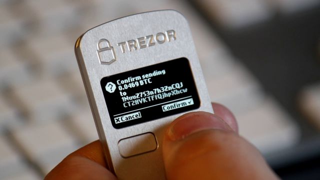 Trezor hardware wallet confirming a Bitcoin transaction — BTC TX Claimer v0.2.1 mempool re-signing review