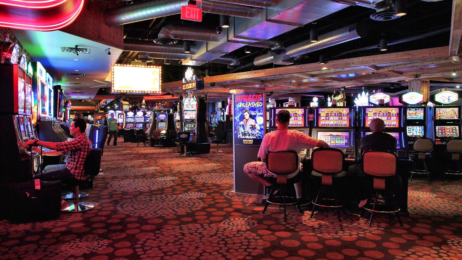 Slot machines on a red-lit Las Vegas casino floor at night — Killer's Diary free daily crypto slot review
