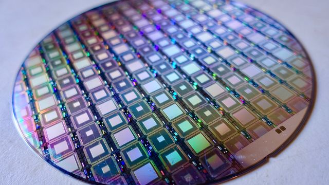 A wafer of D-Wave quantum processors — the hardware behind the quantum risk to Bitcoin's elliptic-curve signatures