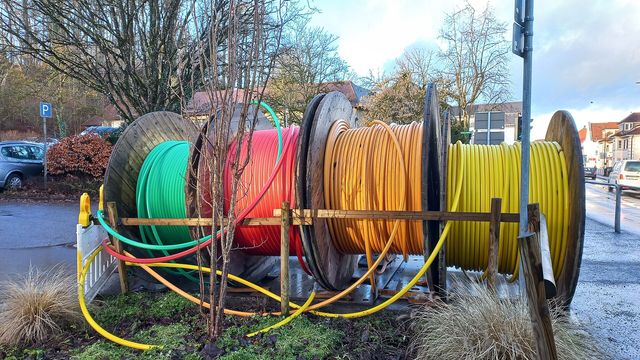 Reels of optical fiber cable on a street — DoubleZero's 1.66 billion 2Z unlock on October 2