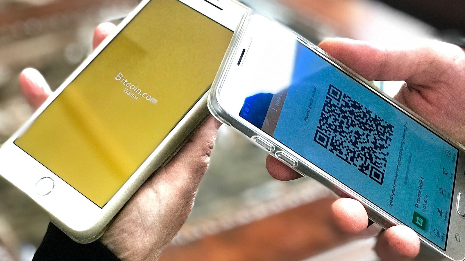 Two mobile phones showing crypto wallet apps being checked — the EarnCrypto Airdrop Checker scanning EVM and Solana wallets for unclaimed airdrop tokens
