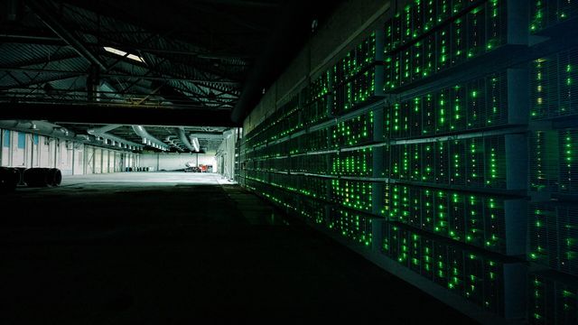 Industrial bitcoin mining farm running ASIC miners — bitcoin difficulty retarget at block 967,680