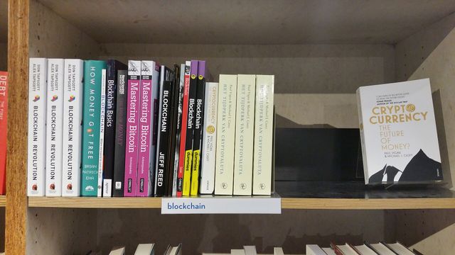 Crypto and blockchain books on a bookstore shelf — the EarnCrypto tag index of 191 topics across 234 articles and 56 hand-checked tools