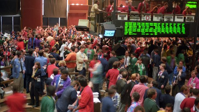 Open-outcry commodities and futures trading floor — how Coinbase merged US and global crypto derivatives into one regulated order book