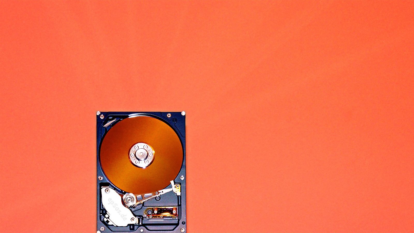 An opened hard disk drive with its platter exposed — Filecoin's October 15 emission cliff and the $1.065 level that decides FIL's next move