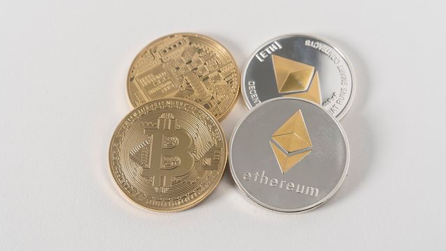 Physical cryptocurrency coins from a crypto trading service — the September 25 Deribit options expiry holds 16.1 billion dollars of Bitcoin and Ether open interest