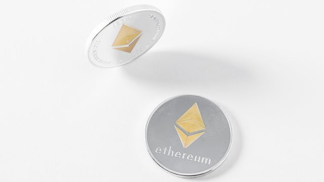 Physical Ethereum coins on a white surface — Glamsterdam cleared Sepolia and Hoodi activates October 26