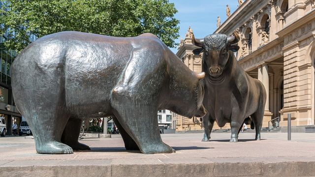 Bull and Bear sculpture in front of the Frankfurt Stock Exchange — bitcoin's $238 million short squeeze and the funding-rate map that decides the $82,000 gate