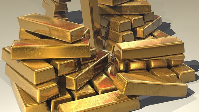 Stacked gold bullion bars — gold’s heaviest session of September as the 10-year Treasury yield closed at a 2026 high of 5.26%