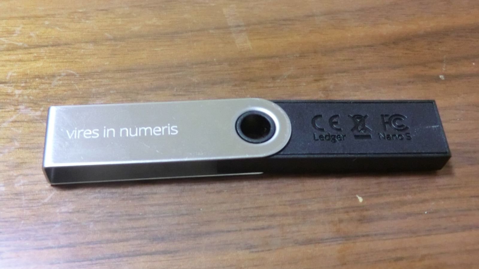 A Ledger Nano S hardware wallet used for self-custody crypto storage — Starknet STRK breakout, strkBTC shielded Bitcoin and 800 million staked tokens