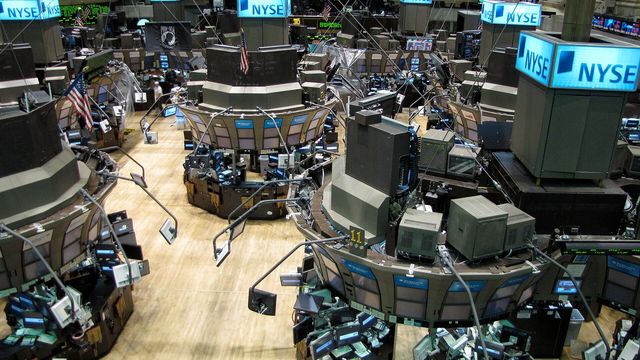 New York Stock Exchange trading floor — Meteora now pairs new Solana token launches with Backpack tokenized Apple, Nvidia and Tesla stock
