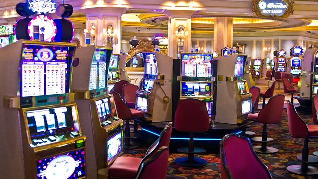 Slot machines on a neon-lit Las Vegas casino floor — Vegas Casino: Lucky Sevens free daily crypto slot review