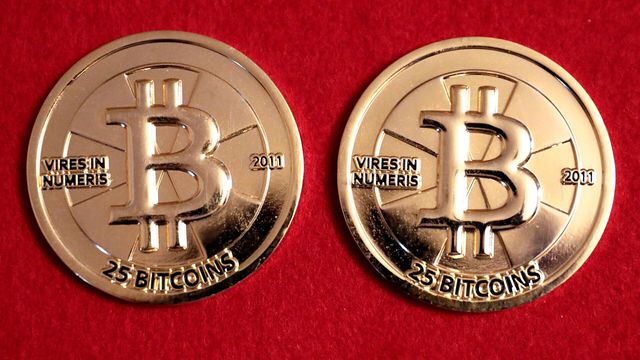 Two gold Casascius 25 BTC physical bitcoin rounds — Bitcoin's Q4 open with open interest down 11.9% and a $4.6 billion call wall above $90,000