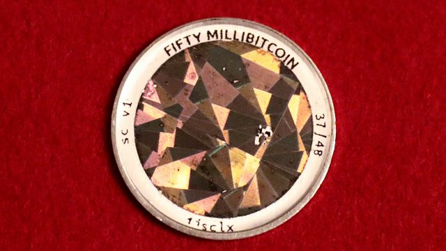 Back of a physical .05 BTC Serp coin on a red backdrop — Sanctum is set to burn 259 million SANC, a quarter of its supply, in October