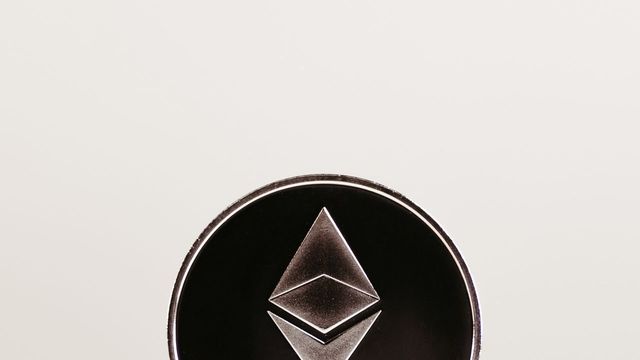 Ethereum coin on a desk, representing ether.fi's ETH staking and restaking protocol