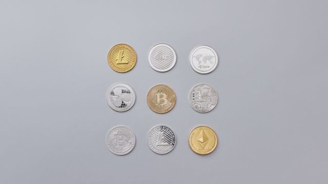 A selection of cryptocurrency tokens on a neutral background — SolEarn's AI validator staking SOL for 30 days