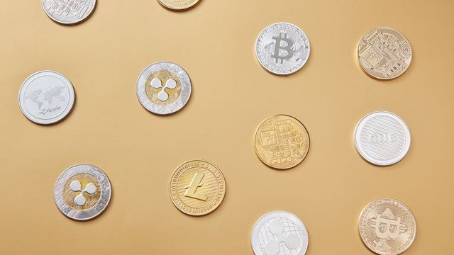 A flat lay of altcoin tokens on gold — BNB double-topped at $726 with the $680 neckline in play