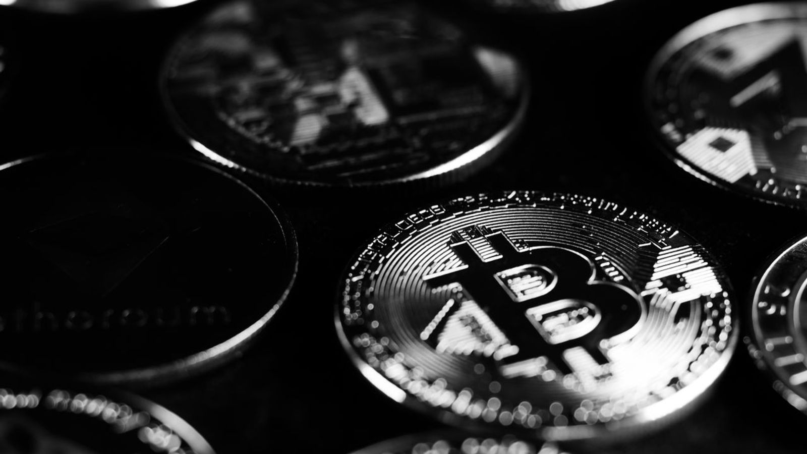 Monochrome close-up of crypto coins — SOL double-rejecting $110 with 94 or 118 in play