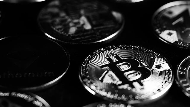 Monochrome close-up of crypto coins — SOL double-rejecting $110 with 94 or 118 in play