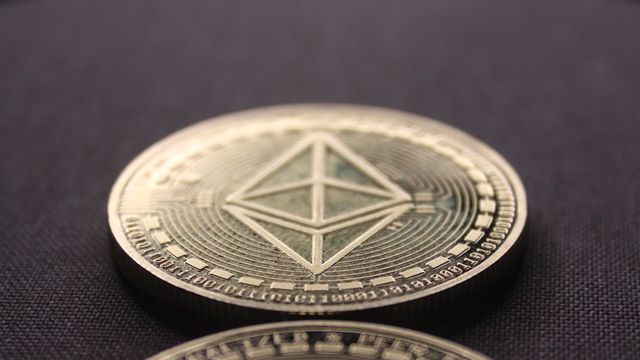 Bitcoin and Ethereum coins on a dark surface — Jupiter's best revenue day in seven months and the JUP reclaim