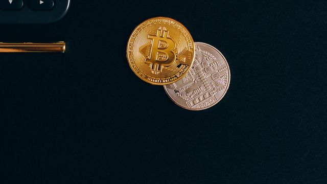 Bitcoin and Ethereum coins beside a calculator — the Airdrop Tracker's seven live campaigns