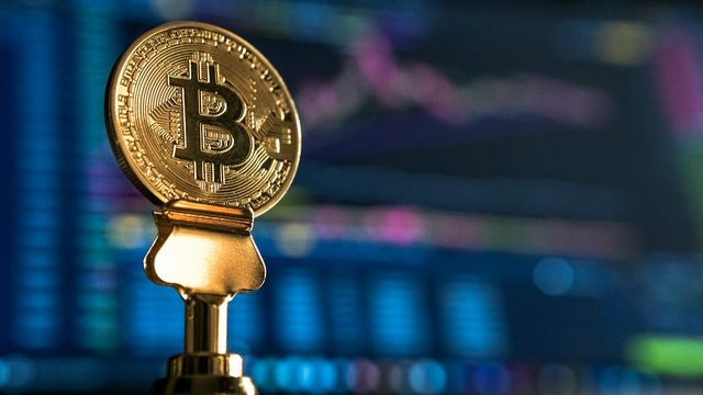 Bitcoin chart on a laptop screen