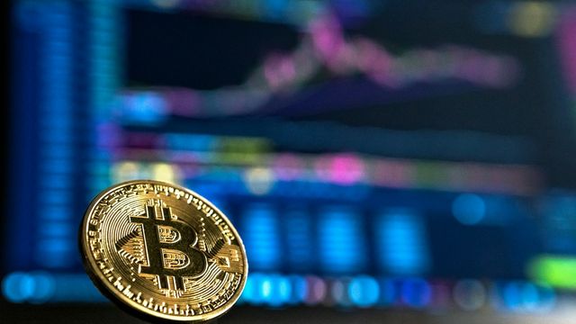Crypto charts and market data screens at night