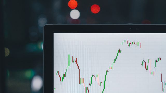 Crypto market charts on a trading monitor