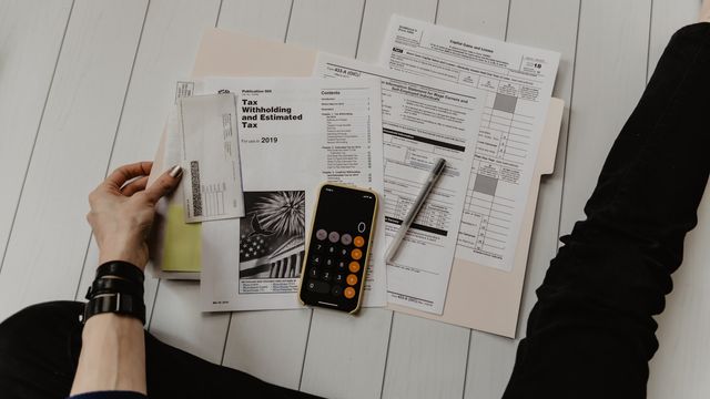 Financial calculator and documents — tokenized stocks, real-world assets