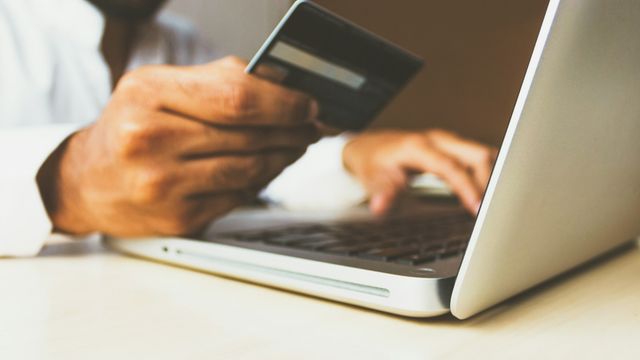 Smartphone displaying cryptocurrency markets and a digital wallet interface