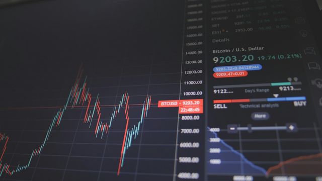 Crypto coins and charts illustrating Solana's network speed upgrade