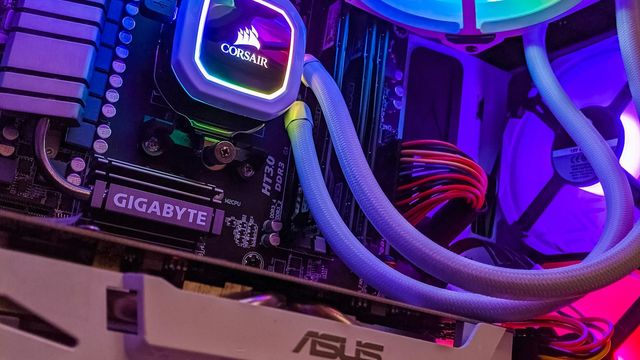 A black and blue computer tower with open hardware — mining BTC, LTC, XMR, ZEC and DOGE from one RigHash balance