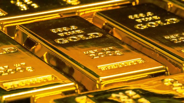 Gold bars — Tether's reserves backed by gold, verified by KPMG audit