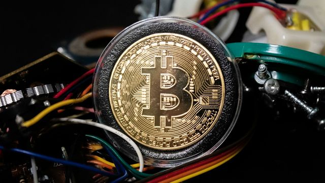 A gold and black crypto coin — XRP's lower highs after the $1.70 spike and the 1.343 fib