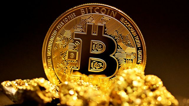 A bitcoin resting on a pile of gold nuggets — bitcoin's $76K floor as the CLARITY Act vote and the Fed decision land